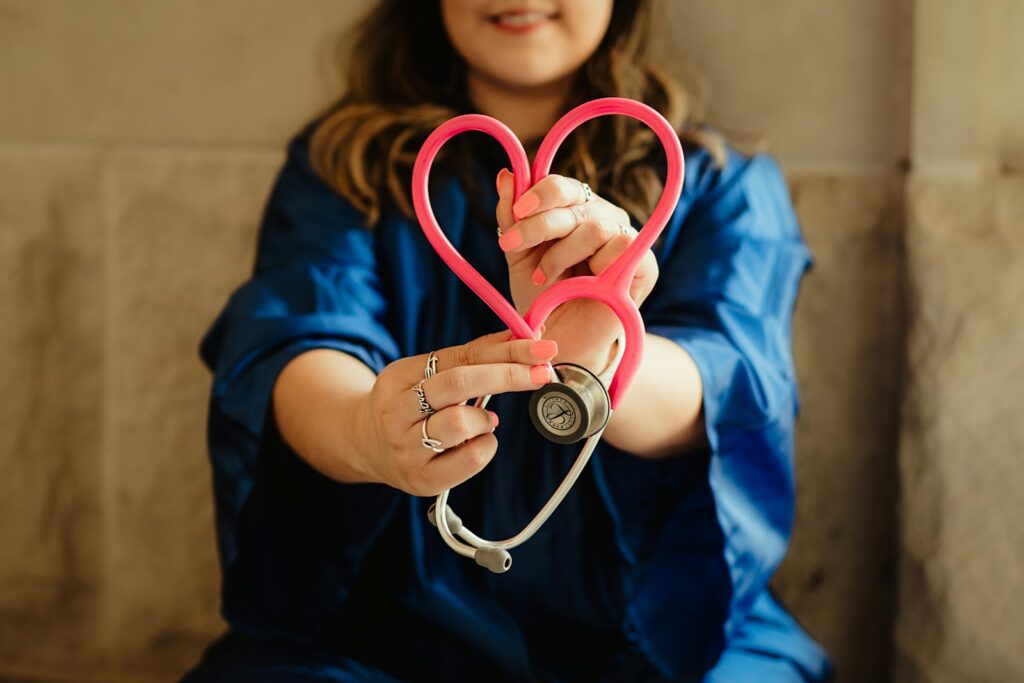 Home 4 girl in blue jacket holding red and silver ring